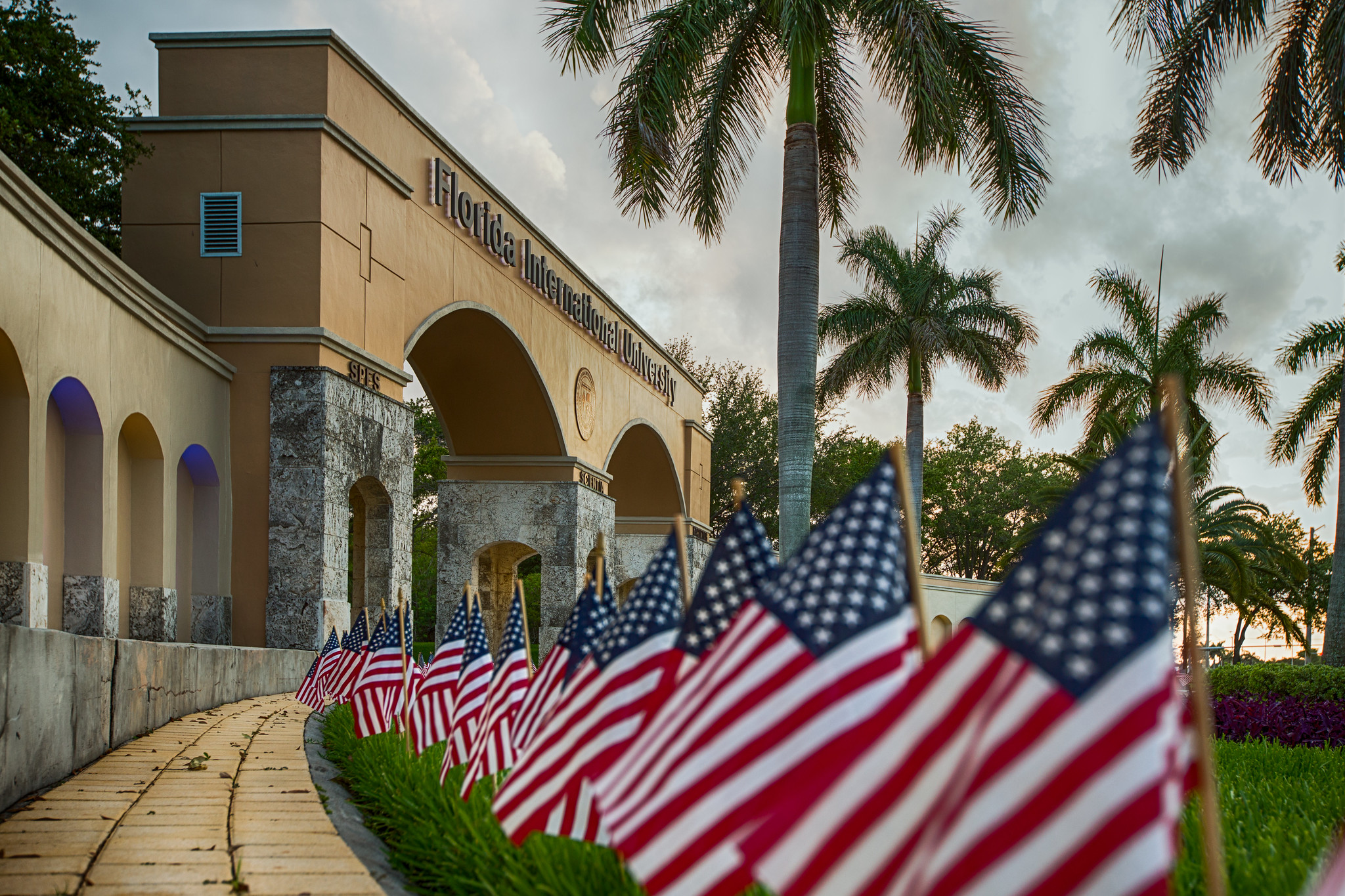 Row of American flags on FIU 8th Street entrance